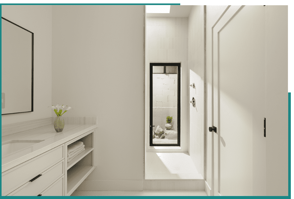 inspired-1 A white bathroom with a glass shower door.